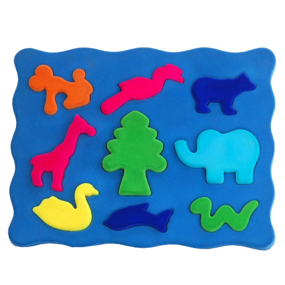 3D shape sorter with blue base and colorful soft animal pieces that fit into the base like a puzzle.